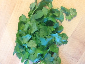 You can buy cilantro in the produce section. Wash it really well and chop it.